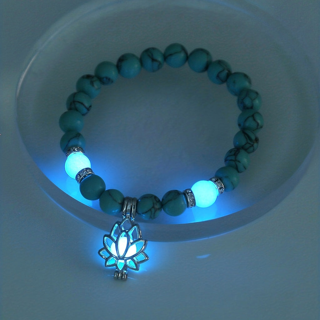One Glowing Lotus Bracelet Featuring Bright Blue Beads And a Lit Lotus Pendant