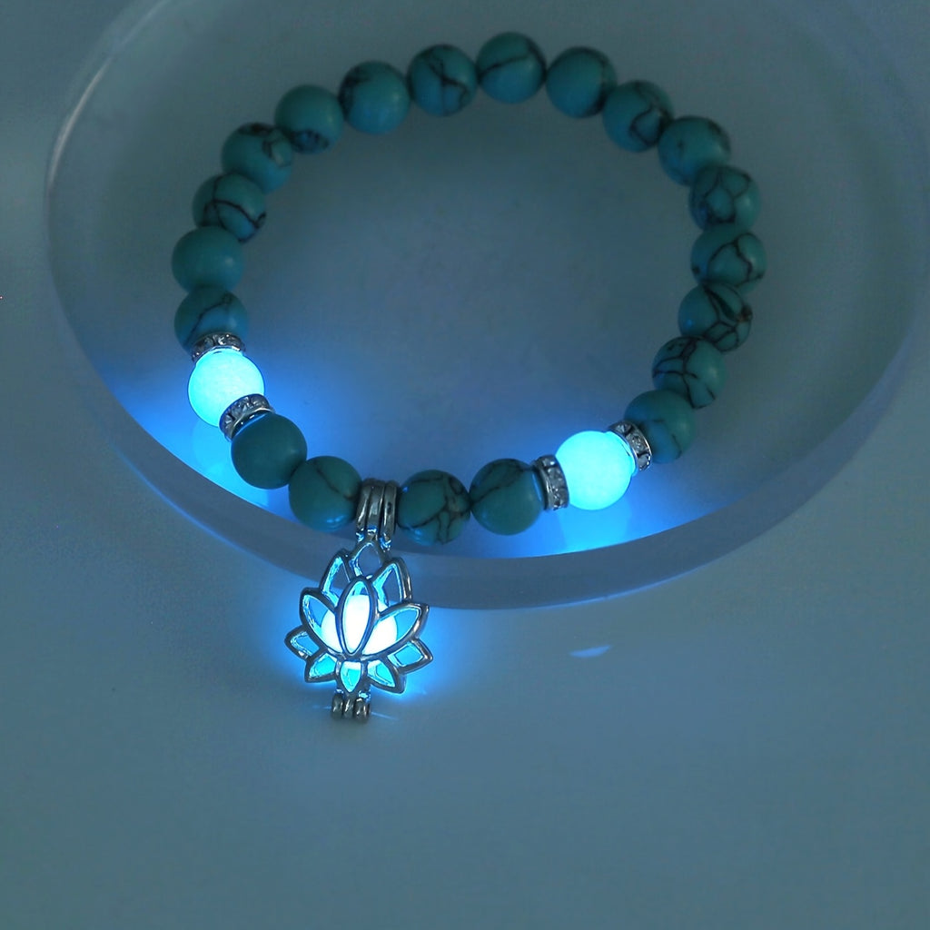 One Glowing Lotus Bracelet Featuring Bright Blue Beads And a Lit Lotus Pendant