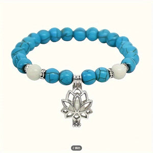One Glowing Lotus Bracelet Featuring Bright Blue Beads And a Lit Lotus Pendant