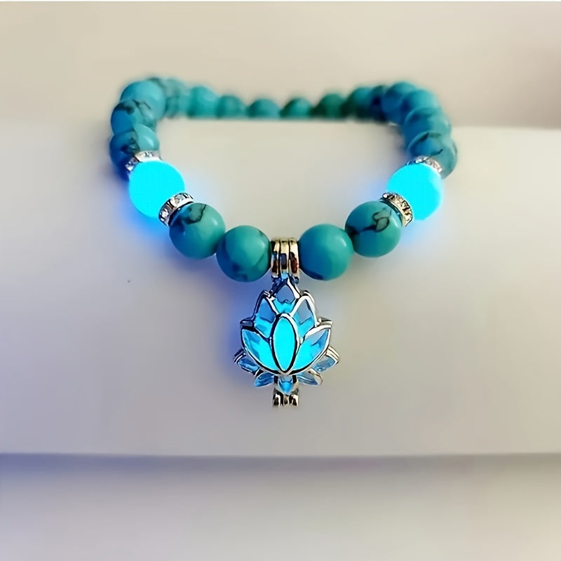 One Glowing Lotus Bracelet Featuring Bright Blue Beads And a Lit Lotus Pendant