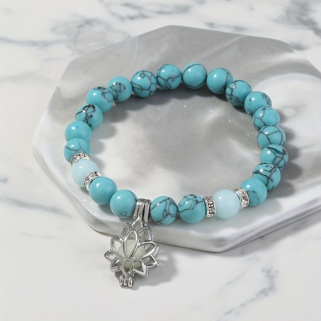 One Glowing Lotus Bracelet Featuring Bright Blue Beads And a Lit Lotus Pendant