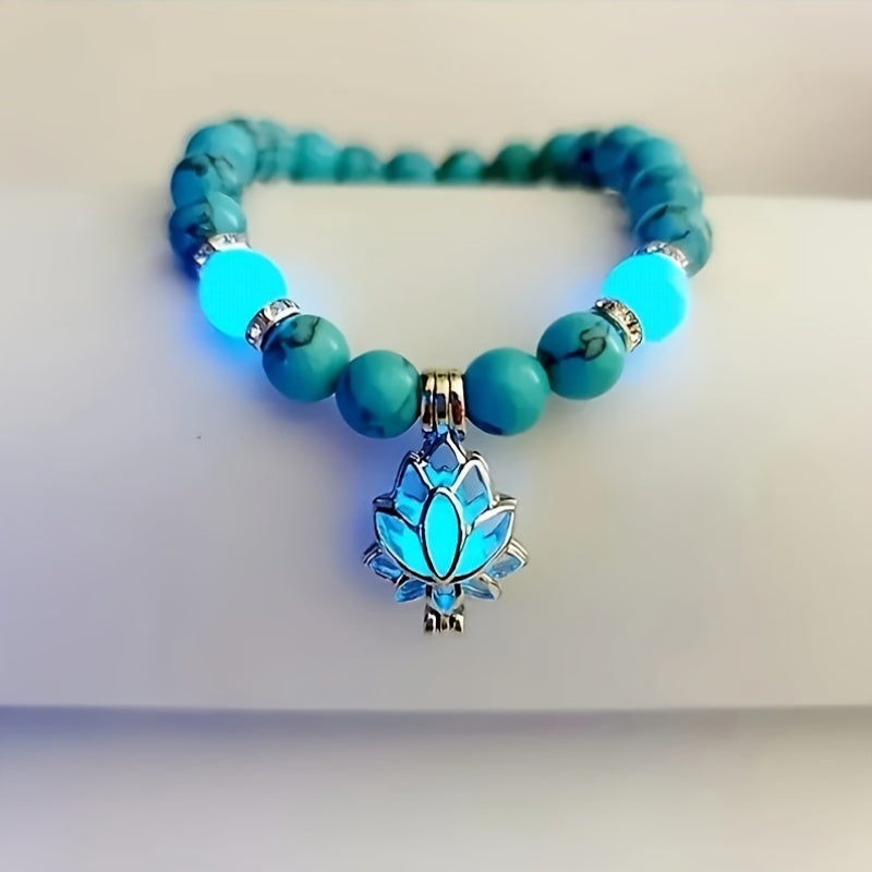 One Glowing Lotus Bracelet Featuring Bright Blue Beads And a Lit Lotus Pendant