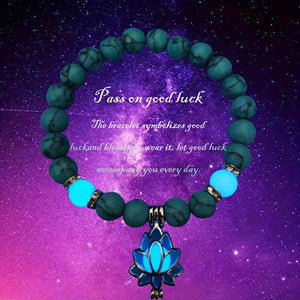 One Glowing Lotus Bracelet Featuring Bright Blue Beads And a Lit Lotus Pendant
